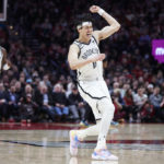 
              Brooklyn Nets forward Yuta Watanabe reacts after making a 3-point basket against the Portland Trail Blazers during the second half of an NBA basketball game in Portland, Ore., Thursday, Nov. 17, 2022. (AP Photo/Craig Mitchelldyer)
            