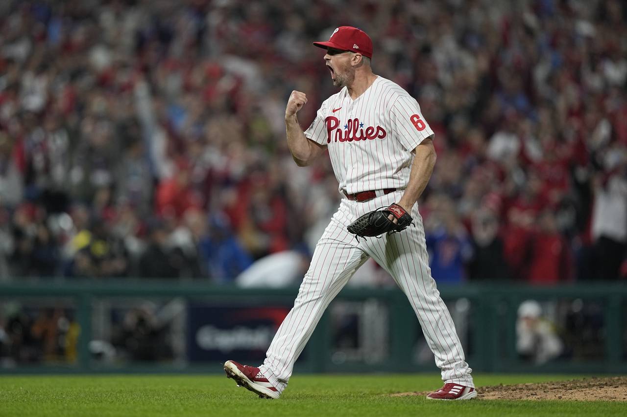 Philadelphia Phillies relief pitcher Andrew Bellatti celebrates their win in Game 3 of baseball's W...
