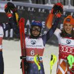 
              From left, second placed Sweden's Anna Swenn Larsson, the winner United States' Mikaela Shiffrin and third placed Slovakia's Petra Vlhova celebrate after an alpine ski, women's World Cup slalom, in Levi, Finland, Saturday, Nov. 19, 2022. (AP Photo/Alessandro Trovati)
            
