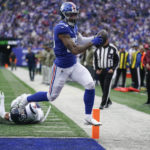 
              New York Giants tight end Lawrence Cager (83) crosses the goal line to score a touchdown against the Houston Texans during the first quarter of an NFL football game, Sunday, Nov. 13, 2022, in East Rutherford, N.J. (AP Photo/Seth Wenig)
            