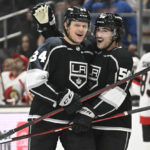 
              Los Angeles Kings right wing Arthur Kaliyev is congratulated by Los Angeles Kings defenseman Sean Durzi after scoring a goal against the Ottawa Senators during the second period in an NHL hockey game Sunday, Nov. 27, 2022, in Los Angeles. (AP Photo/John McCoy)
            