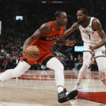 
              Toronto Raptors forward O.G. Anunoby (3) drives against Brooklyn Nets forward Kevin Durant (7) during the first half of an NBA basketball game Wednesday, Nov. 23, 2022, in Toronto. (Chris Young/The Canadian Press via AP)
            