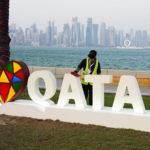 
              A worker cleans a sign "I love Qatar" ahead of the World Cup group A soccer match between Qatar and Ecuador, in Doha, Qatar, Sunday, Nov. 20, 2022. (AP Photo/Pavel Golovkin)
            