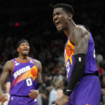 
              Phoenix Suns center Deandre Ayton, right, celebrates his blocked shot against the Chicago Bulls as Suns forward Torrey Craig (0) joins in on the shouting during the second half of an NBA basketball game in Phoenix, Wednesday, Nov. 30, 2022. The Suns won 132-113. (AP Photo/Ross D. Franklin)
            