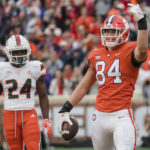 
              Clemson tight end Davis Allen celebrates after scoring a touchdown in the first half of an NCAA college football game against Miami on Saturday, Nov. 19, 2022, in Clemson, S.C. (AP Photo/Jacob Kupferman)
            