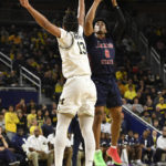 
              Jackson State guard Gabe Watson, right, shoots over Michigan guard Jett Howard in the first half of an NCAA college basketball game, Wednesday, Nov. 23, 2022, in Ann Arbor, Mich. (AP Photo/Jose Juarez)
            