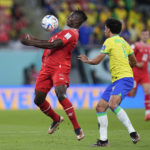 
              Switzerland's Breel Embolo, left, vies for the ball with Brazil's Marquinhos during the World Cup group G soccer match between Brazil and Switzerland, at the Stadium 974 in Doha, Qatar, Monday, Nov. 28, 2022. (AP Photo/Ariel Schalit)
            