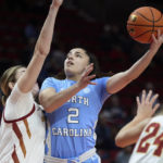 
              North Carolina guard Paulina Paris, cneter, shoots over Iowa State forward Morgan Kane during the first half of an NCAA college basketball game in the Phil Knight Invitational in Portland, Ore., Sunday, Nov. 27, 2022. (AP Photo/Craig Mitchelldyer)
            