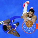 
              Brooklyn Nets' Ben Simmons, right, goes up for a dunk past Philadelphia 76ers' Paul Reed during the second half of an NBA basketball game, Tuesday, Nov. 22, 2022, in Philadelphia. (AP Photo/Matt Slocum)
            