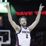 
              Gonzaga forward Drew Timme reacts after making a basket during the first half of an NCAA college basketball game, against Kentucky, Sunday, Nov. 20, 2022, in Spokane, Wash. (AP Photo/Young Kwak)
            