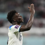 
              England's Bukayo Saka celebrates after scoring his side's fourth goal against Iran during the World Cup group B soccer match between England and Iran at the Khalifa International Stadium, in Doha, Qatar, Monday, Nov. 21, 2022. (AP Photo/Martin Meissner)
            