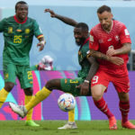 
              Switzerland's Haris Seferovic, right, vies for the ball with Cameroon's Nicolas Nkoulou and Tolo Nouhou during the World Cup group G soccer match between Switzerland and Cameroon, at the Al Janoub Stadium in Al Wakrah, Qatar, Thursday, Nov. 24, 2022. Switzerland won 1-0. (AP Photo/Luca Bruno)
            