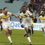 
              Senegal's Ismaila Sarr, right, celebrates with teammates after scoring a penalty, the opening goal of his team, during the World Cup group A soccer match between Ecuador and Senegal, at the Khalifa International Stadium in Doha, Qatar, Tuesday, Nov. 29, 2022. (AP Photo/Natacha Pisarenko)
            