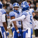 
              Kentucky wide receiver Dane Key, center, is surrounded by teammates after scoring a touchdown during the first quarter of an NCAA college football game against Missouri, Saturday, Nov. 5, 2022, in Columbia, Mo. (AP Photo/L.G. Patterson)
            