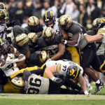 
              Iowa running back Jaziun Patterson,left, carries the ball during the second half of an NCAA college football game against Purdue, Saturday, Nov. 5, 2022, in West Lafayette, Ind. (AP Photo/Marc Lebryk)
            