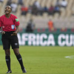 
              FILE - Referee Salima Mukansanga of Rwanda gestures to the players during the African Cup of Nations 2022 group B soccer match between Zimbabwe and Guinea at the Ahmadou Ahidjo stadium in Yaounde, Cameroon, Tuesday, Jan. 18, 2022. (AP Photo/Themba Hadebe, File)
            