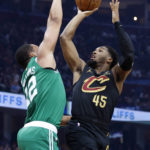 
              Cleveland Cavaliers guard Donovan Mitchell (45) shoots against Boston Celtics forward Grant Williams (12) during the first half of an NBA basketball game Wednesday, Nov. 2, 2022, in Cleveland. (AP Photo/Ron Schwane)
            