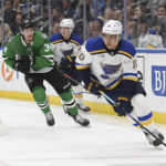 
              St. Louis Blues' Brayden Schenn advances the puck during the first period of an NHL hockey game, Monday, Nov. 28, 2022, in St. Louis. (AP Photo/Michael Thomas)
            