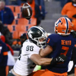 
              Michigan State defensive end Avery Dunn (98) breaks up a pass thrown by Illinois quarterback Tommy DeVito (3) during the second half of an NCAA college football game, Saturday, Nov. 5, 2022, in Champaign, Ill. (AP Photo/Matt Marton)
            