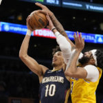 
              New Orleans Pelicans center Jaxson Hayes, left, shoots as Los Angeles Lakers forward Anthony Davis defends during the first half of an NBA basketball game Wednesday, Nov. 2, 2022, in Los Angeles. (AP Photo/Mark J. Terrill)
            