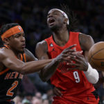 
              Portland Trail Blazers forward Jerami Grant (9) is fouled by New York Knicks guard Miles McBride during the first half of an NBA basketball game Friday, Nov. 25, 2022, in New York. (AP Photo/Adam Hunger)
            