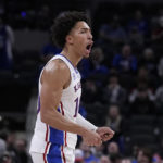 
              Kansas forward Jalen Wilson (10) reacts to a score against Duke during the second half of an NCAA college basketball game, Wednesday, Nov. 16, 2022, in Indianapolis. (AP Photo/Darron Cummings)
            