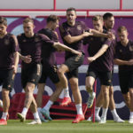 
              Germany's Jonas Hofmann, from left, David Raum, Leon Goretzka, Christian Guenter, Matthias Ginter, Niklas Suele and Joshua Kimmich warm up for a training session at the Al-Shamal stadium on the eve of the group E World Cup soccer match between Germany and Japan, in Al-Ruwais, Qatar, Tuesday, Nov. 22, 2022. Germany will play the first match against Japan on Wednesday, Nov. 23. (AP Photo/Matthias Schrader)
            