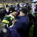 
              Green Bay Packers quarterback Aaron Rodgers, center left, and Dallas Cowboys head coach Mike McCarthy, center right, greet each other after the Packers 31-28 overtime win in an NFL football game Sunday, Nov. 13, 2022, in Green Bay, Wis. (AP Photo/Matt Ludtke)
            