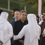
              U.S. Secretary of State Anthony Blinken, center, listens to officials during a visit to Oxygen Park at Education City, in Doha Qatar, Monday Nov. 21, 2022. (Karim Jaafar/Pool via AP)
            