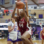 
              Stanford forward Kiki Iriafen (44) drives to the basket during the first half against Portland during an NCAA college basketball game in Portland, Ore., Sunday, Nov. 13, 2022. (AP Photo/Troy Wayrynen)
            