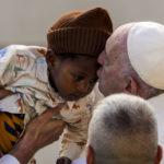 
              Pope Francis kisses a child at the end his weekly general audience in St. Peter's Square at The Vatican, Wednesday, Nov. 23, 2022. (AP Photo/Andrew Medichini)
            