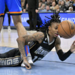 
              Memphis Grizzlies guard Ja Morant falls to the court in the first half of the team's NBA basketball game against the Oklahoma City Thunder on Friday, Nov. 18, 2022, in Memphis, Tenn. (AP Photo/Brandon Dill)
            