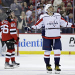 
              Washington Capitals left wing Alex Ovechkin watches a replay of a goal scored by New Jersey Devils center Jack Hughes (86) during the second period of an NHL hockey game Saturday, Nov. 26, 2022, in Newark, N.J. (AP Photo/Adam Hunger)
            