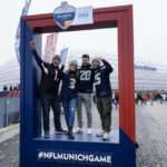
              Fans of the Seahawks pose for a photo as they arrive for a NFL match between Tampa Bay Buccaneers and Seattle Seahawks at the Allianz Arena in Munich, Germany, Sunday, Nov. 13, 2022. (AP Photo/Markus Schreiber)
            
