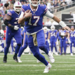 
              Buffalo Bills quarterback Josh Allen, right, rushes for a touchdown during the first half of an NFL football game, Sunday, Nov. 6, 2022, in East Rutherford, N.J. (AP Photo/John Minchillo)
            