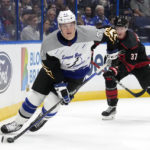 
              Tampa Bay Lightning defenseman Cal Foote (52) breaks out ahead of Carolina Hurricanes right wing Andrei Svechnikov (37) during the first period of an NHL hockey game Thursday, Nov. 3, 2022, in Tampa, Fla. (AP Photo/Chris O'Meara)
            