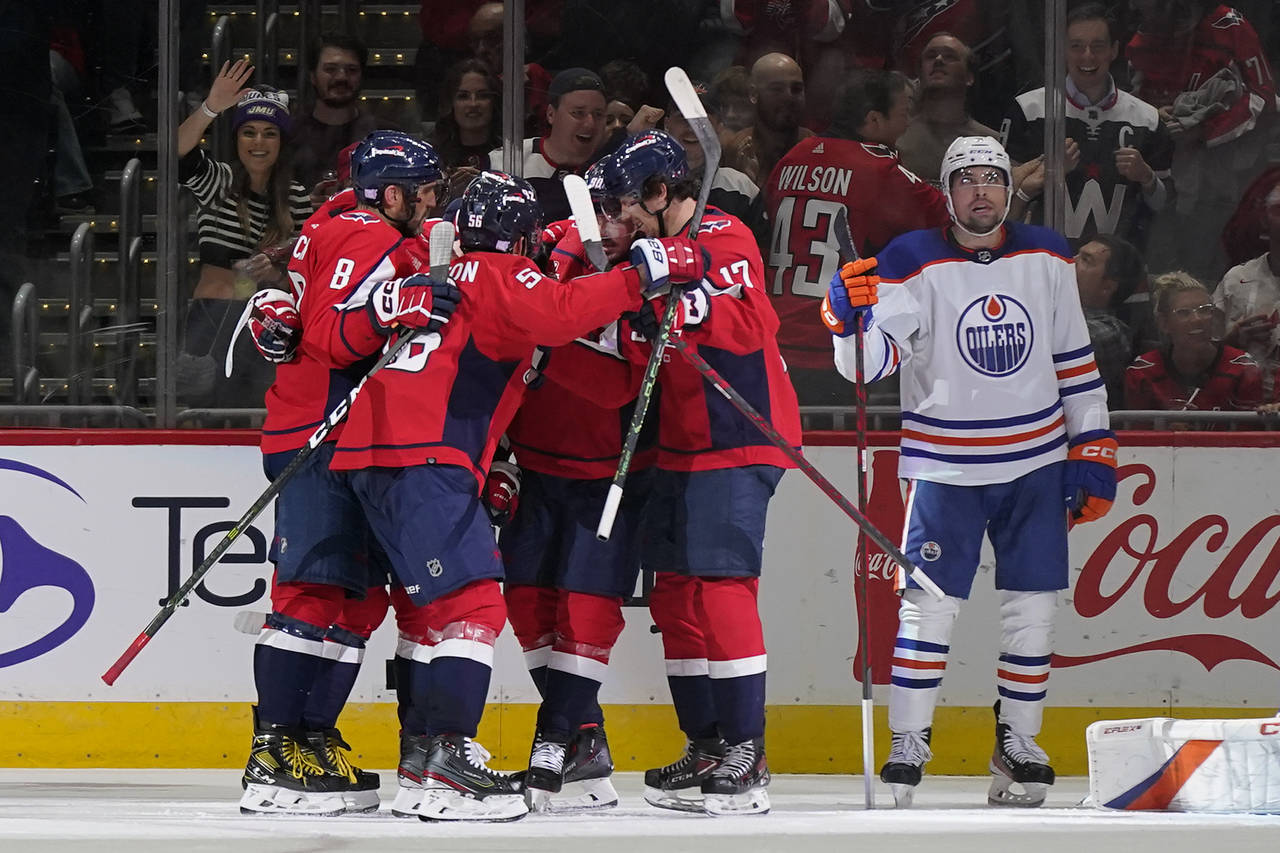 Members of the Washington Capitals celebrate Evgeny Kuznetsov's goal in the second period of an NHL...