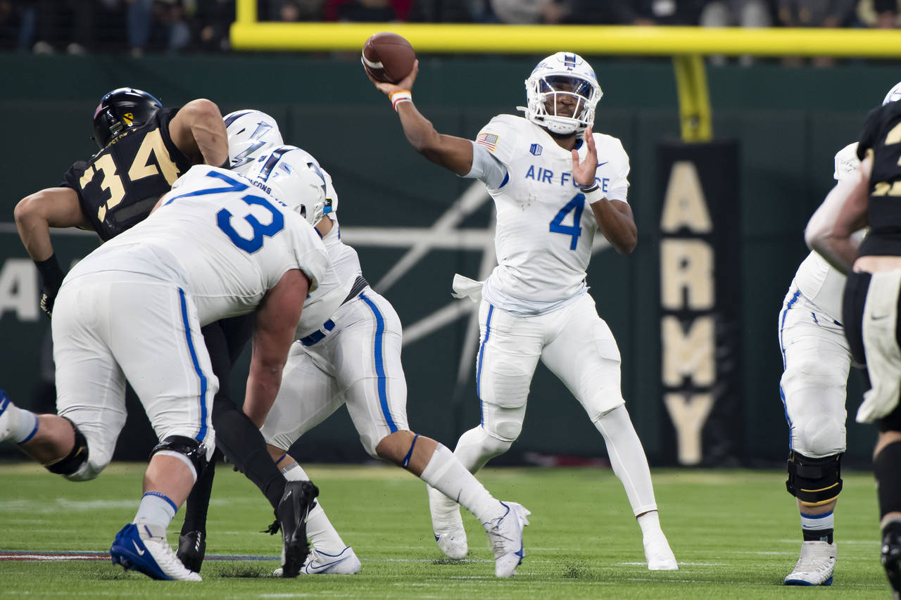 Air Force quarterback Haaziq Daniels (4) throws a pass during an NCAA college football game against...