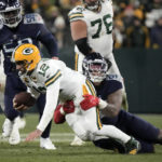 
              Green Bay Packers quarterback Aaron Rodgers (12) is sacked by Tennessee Titans defensive tackle Jeffery Simmons (98) during the second half of an NFL football game Thursday, Nov. 17, 2022, in Green Bay, Wis. (AP Photo/Morry Gash)
            