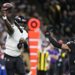 
              Baltimore Ravens quarterback Lamar Jackson (8) throws under pressure from New Orleans Saints safety Chris Harris Jr., (19) in the first half of an NFL football game in New Orleans, Monday, Nov. 7, 2022. (AP Photo/Gerald Herbert)
            