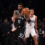 
              Brooklyn Nets guard Kyrie Irving (11) holds the ball during the first half of an NBA basketball game against the Orlando Magic, Monday, Nov. 28, 2022, in New York. (AP Photo/Julia Nikhinson)
            