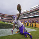 
              Minnesota Vikings running back Dalvin Cook (4) holds up the ball in the air after making a touchdown catch against Washington Commanders safety Kamren Curl (31) during the second half of an NFL football game, Sunday, Nov. 6, 2022, in Landover, Md. (AP Photo/Julio Cortez)
            