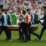 
              Medics carry Iran's goalkeeper Alireza Beiranvand from the pitch after sustaining an injury during the World Cup group B soccer match between England and Iran at the Khalifa International Stadium in Doha, Qatar, Monday, Nov. 21, 2022. (AP Photo/Frank Augstein)
            