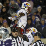 
              Kansas running back Devin Neal (4) celebrates his touchdown with offensive lineman Ar'maj Reed-Adams (55) during the second quarter of the team's NCAA college football game against Kansas State on Saturday, Nov. 26, 2022, in Manhattan, Kan. (AP Photo/Colin E. Braley)
            