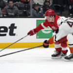 
              Detroit Red Wings' Jonatan Berggren, left, is defended by Anaheim Ducks defenseman Austin Strand during the second period of an NHL hockey game Tuesday, Nov. 15, 2022, in Anaheim, Calif. (AP Photo/Marcio Jose Sanchez)
            