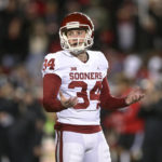 
              Oklahoma place-kicker Zach Schmit (34) reacts after his missed field goal in overtime against Texas Tech during an NCAA college football game Saturday, Nov. 26, 2022, in Lubbock, Texas. (Ian Maule/Tulsa World via AP)
            