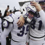 
              TCU place kicker Griffin Kell (39) celebrates with Jordy Sandy (31) and other teammates after hitting a field goal in the final seconds of an NCAA college football game against Bayor in Waco, Texas, Saturday, Nov. 19, 2022. TCU won 29-28. (AP Photo/LM Otero)
            