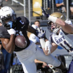 
              Navy linebacker Eavan Gibbons (11) breaks up a pass intended for Central Florida wide receiver Ryan O'Keefe, left, during the first half of an NCAA college football game, Saturday, Nov. 19, 2022, in Orlando, Fla. (AP Photo/John Raoux)
            