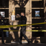 
              Law enforcement continue their investigation of a deadly overnight shooting at Coronado Hall on the campus of the University of New Mexico in Albuquerque, N.M., on Saturday, Nov. 19, 2022. (Chancey Bush/The Albuquerque Journal via AP)
            