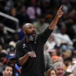 
              Brooklyn Nets acting head coach Jacque Vaughn points during the second half of an NBA basketball game, Friday, Nov. 4, 2022, in Washington. (AP Photo/Nick Wass)
            